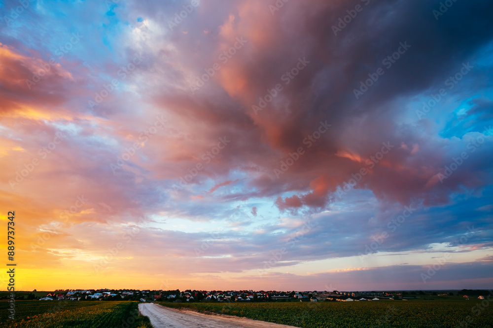 Spectacular colorful sunset with cloudy sky in rural area. Spectacular colorful sunset with cloudy sky in rural area.