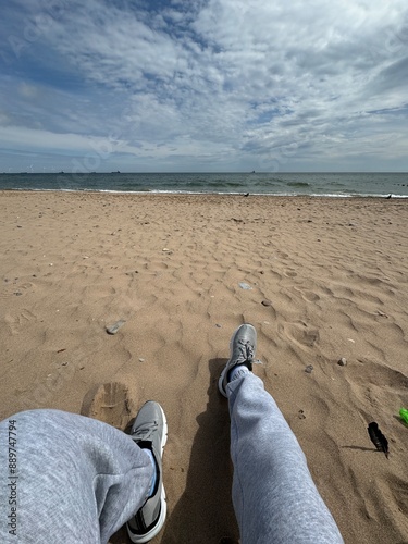 the person sitting on the beach