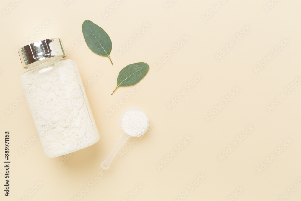 Jars with protein powder on color background, top view. Sports nutrition concept Jars with protein powder on color background, top view. Sports nutrition concept