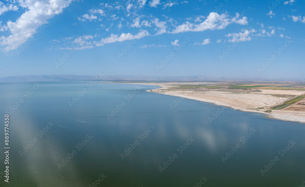 Aerial daytime view of the Salton Sea Coastline with clouds reflecting in the water Aerial daytime view of the Salton Sea Coastline with clouds reflecting in the water