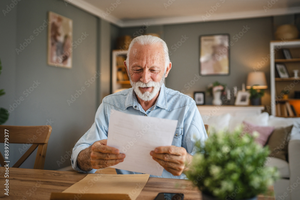 Senior man read a letter document from envelope whit good news Senior man read a letter document from envelope whit good news