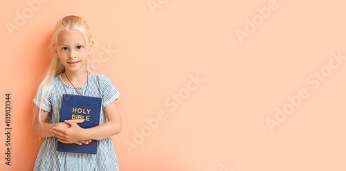 Little girl with Bible on b...