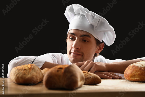 Handsome young chef with lo...