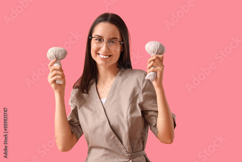 Female massage therapist in...