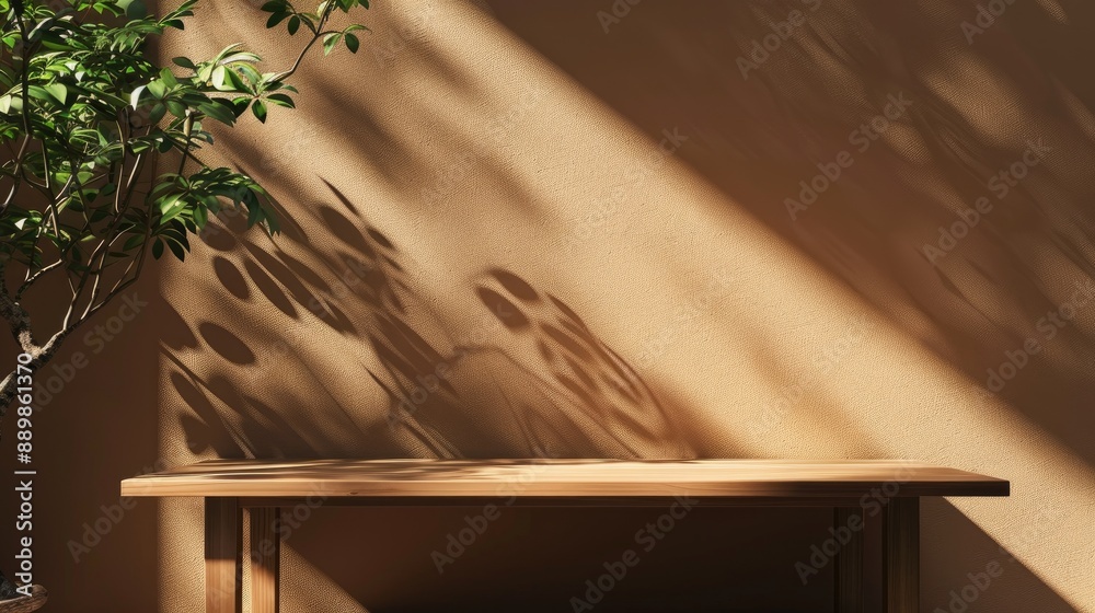 Empty table with mock branding displays on a brown wall with nature shadows Empty table with mock branding displays on a brown wall with nature shadows