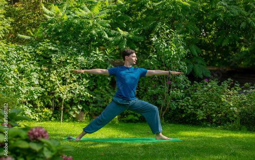 man doing yoga in nature