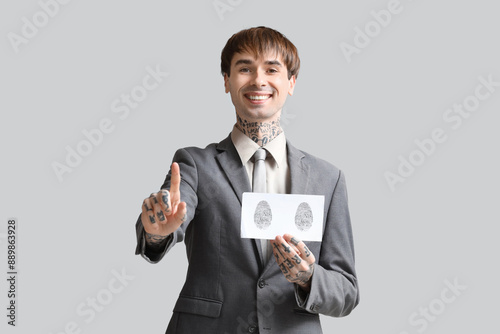 Young businessman with fing...