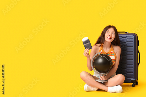 Young Asian woman with glob...