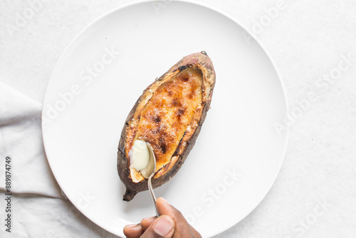 Fotografie Overhead view of sweet potato crème brûlée on a white plate, top view of a sweet