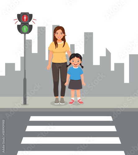 Cute little girl and her mother waiting to cross the road on zebra crossing