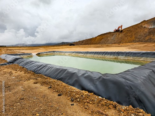 Construction of geomembrane pool in open pit mine. photo