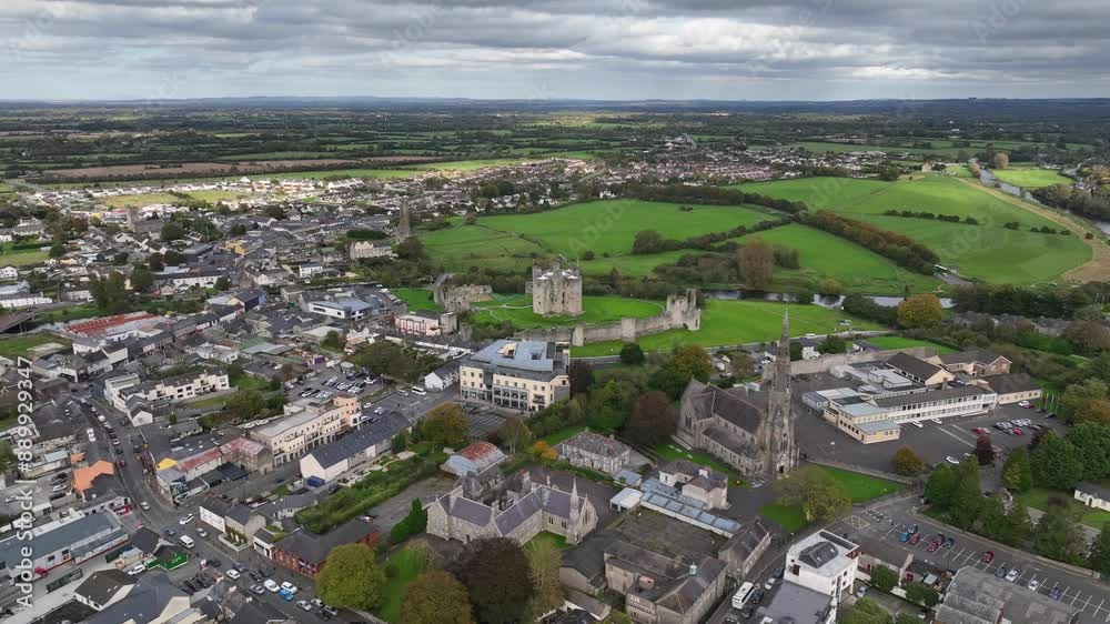 Trim Castle, County Meath, Ireland, October 2023. Drone clockwise orbit of the historic Norman Stronghold with St. Patrick's Chuch in the foreground surrounded by lush green fields on an overcast day. Trim Castle, County Meath, Ireland, October 2023. Drone clockwise orbit of the historic Norman Stronghold with St. Patrick's Chuch in the foreground surrounded by lush green fields on an overcast day.