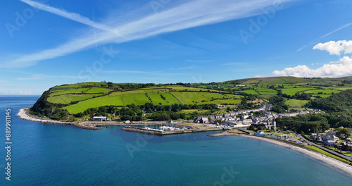 Aerial view of the Beautiful Village of Glenarm on the Irish Sea Antrim Northern Ireland on a sunny day with a blue sky photo