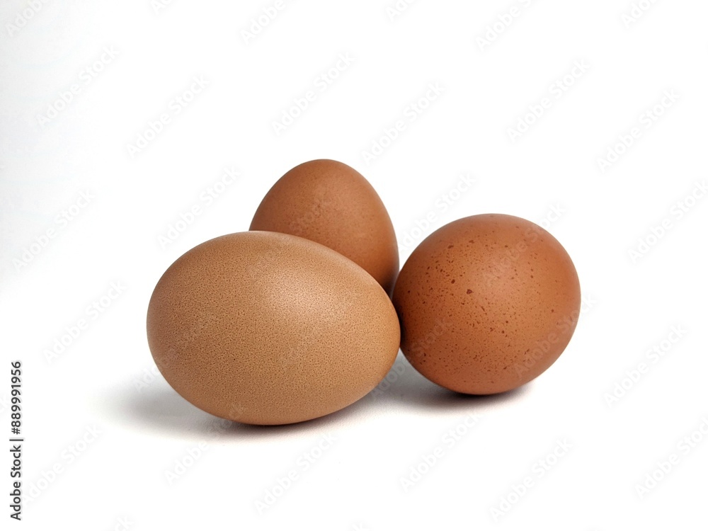 Brown chicken eggs isolated against white background Brown chicken eggs isolated against white background