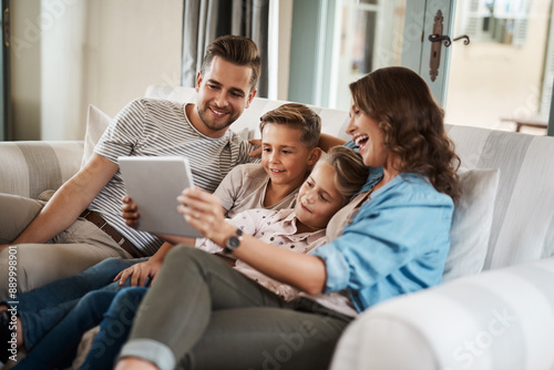 Parents, kids and smile with tablet on sofa for education games, cartoon and entertainment. People, family and happy on couch in living room with fun videos for child or brain development and growth