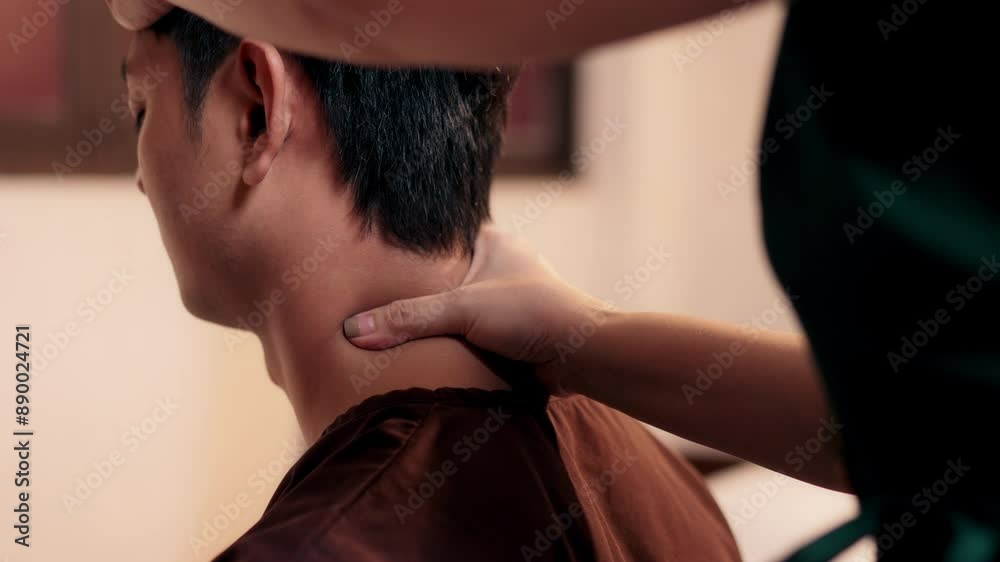 Close-up shot, Asian man customer get service thai massage of neck stretching for treat painful with masseur in spa salon. Thai massage with masseur in spa salon.