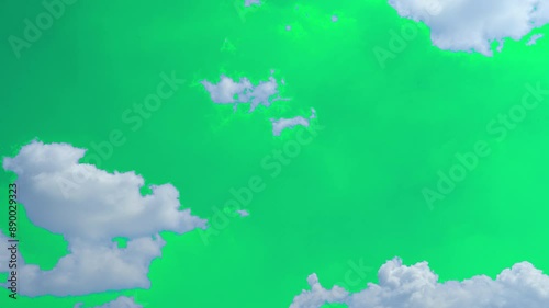 The green screen of moving white clouds with 4K resolution. Can use to change the background color.	