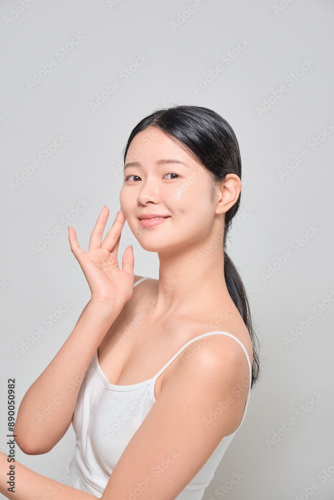 Female model smiling with confidence after applying makeup. Female model smiling with confidence after applying makeup.