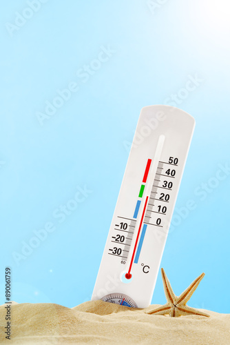 Thermometer Measuring High Temperature in Sand on Sunny Day