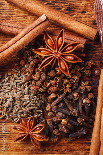 aromatic Chinese five spices on a dark rustic background