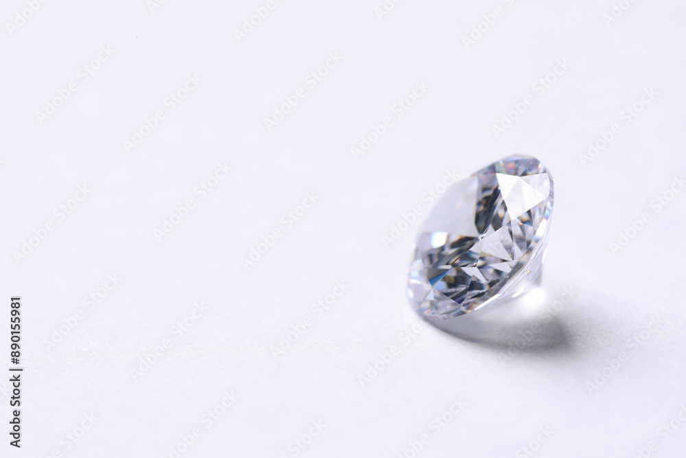 One beautiful shiny diamond on white background, closeup. Space for text One beautiful shiny diamond on white background, closeup. Space for text