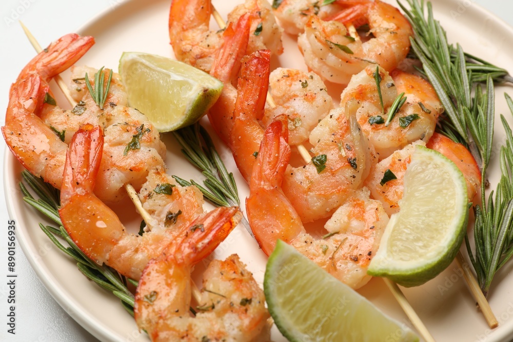 Skewers with delicious grilled shrimps served on plate, closeup Skewers with delicious grilled shrimps served on plate, closeup