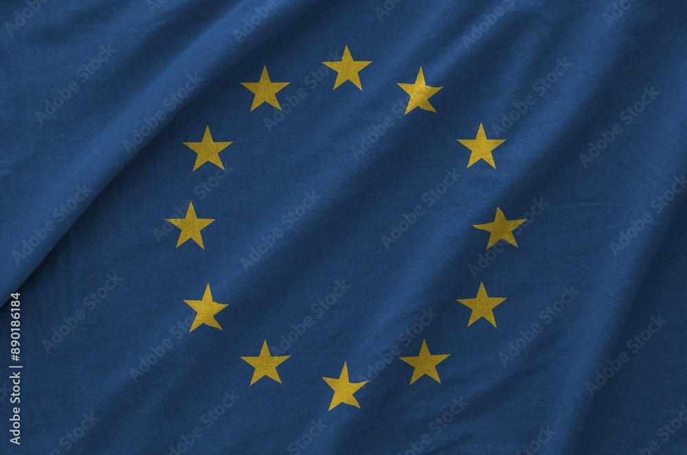 European union flag depicted on folded wavy fabric of old cloth close up European union flag depicted on folded wavy fabric of old cloth close up