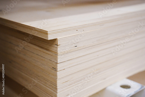 sheets of plywood on a rack in a hardware store. sale of building materials for repair and construction.