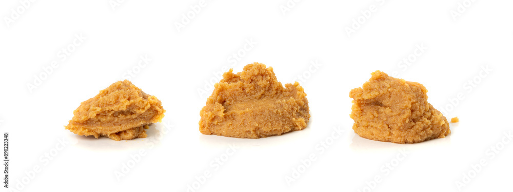 Miso paste isolated. Japanese shiro miso seasoning sauce, fermented soybean spread, brown soy cream Miso paste isolated. Japanese shiro miso seasoning sauce, fermented soybean spread, brown soy cream