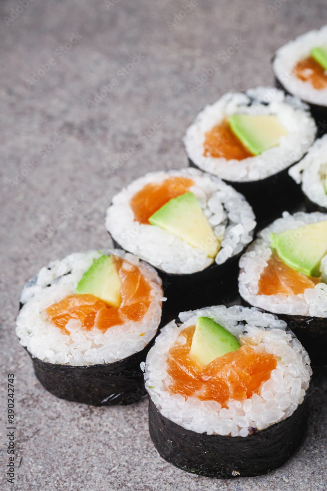 delicious fresh futomaki sushi roll with salmon and avocado delicious fresh futomaki sushi roll with salmon and avocado