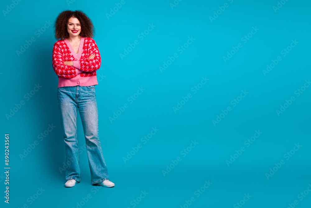 Full length photo of cheerful pretty lady dressed red cardigan arms crossed empty space isolated blue color background Full length photo of cheerful pretty lady dressed red cardigan arms crossed empty space isolated blue color background
