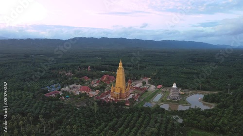 Drone video, high angle, Wat Mahathat Wachira Mongkhon (Wat Bang Thong), Krabi Province, 46 Moo 3, Na Nuea Subdistrict, Ao Luek District, Krabi 81110 Thailand. photo