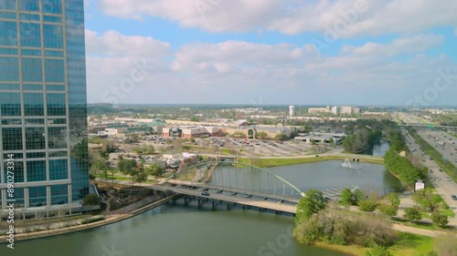 Push in establishing aerial shot of the Woodlands bridge next to the Allison Tower toward the Woodlands mall. Drone shot of the Woodlands bridge next to the interstate 45 photo