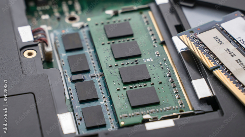 notebook computer RAM memory compartment opened. RAM memory slot of a notebook computer with cover open notebook computer RAM memory compartment opened. RAM memory slot of a notebook computer with cover open