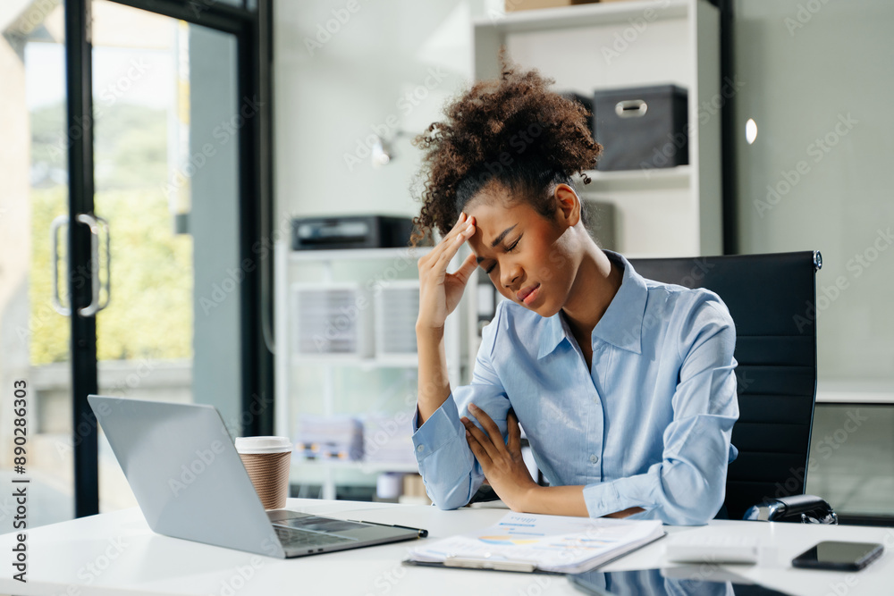 Business woman is stressed, bored, and overthinking from working on a tablet at the modern office.. Business woman is stressed, bored, and overthinking from working on a tablet at the modern office..