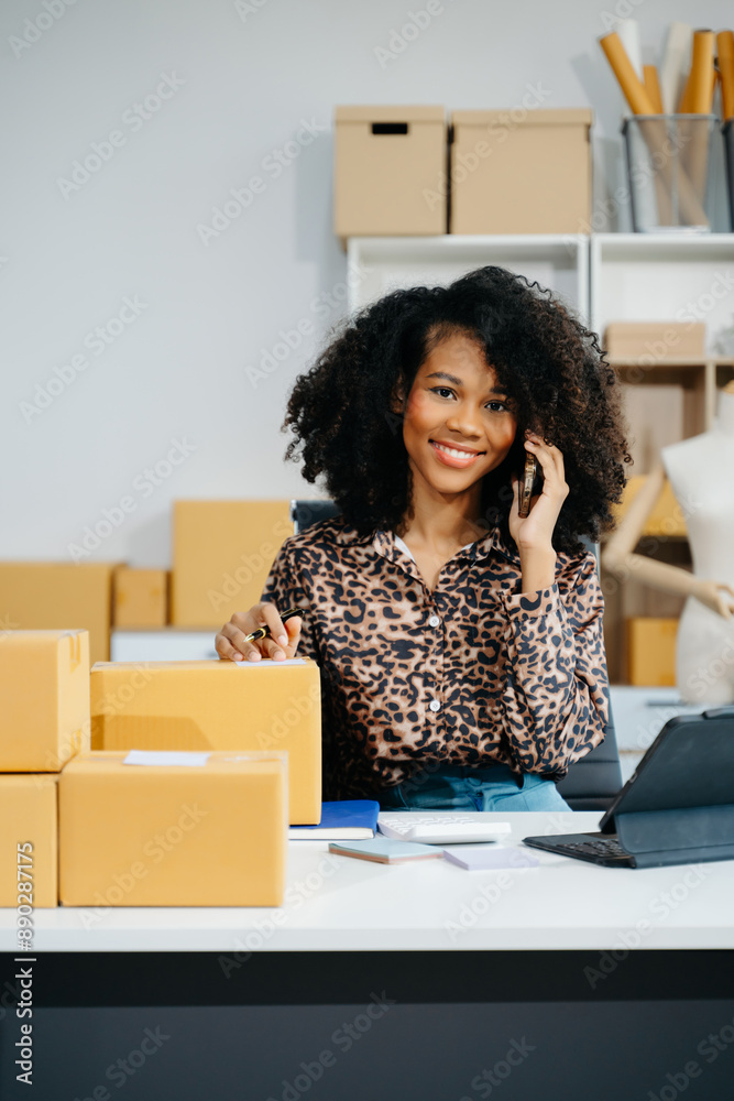 Startup small business SME, Entrepreneur owner woman using smartphone or tablet taking receive and checking online purchase shopping order Startup small business SME, Entrepreneur owner woman using smartphone or tablet taking receive and checking online purchase shopping order