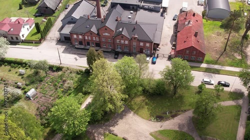 A stunning aerial view of Rujiena city, showcasing its charming buildings, streets, and lush greenery. The drone captures the unique layout and natural beauty of this Latvian city. photo