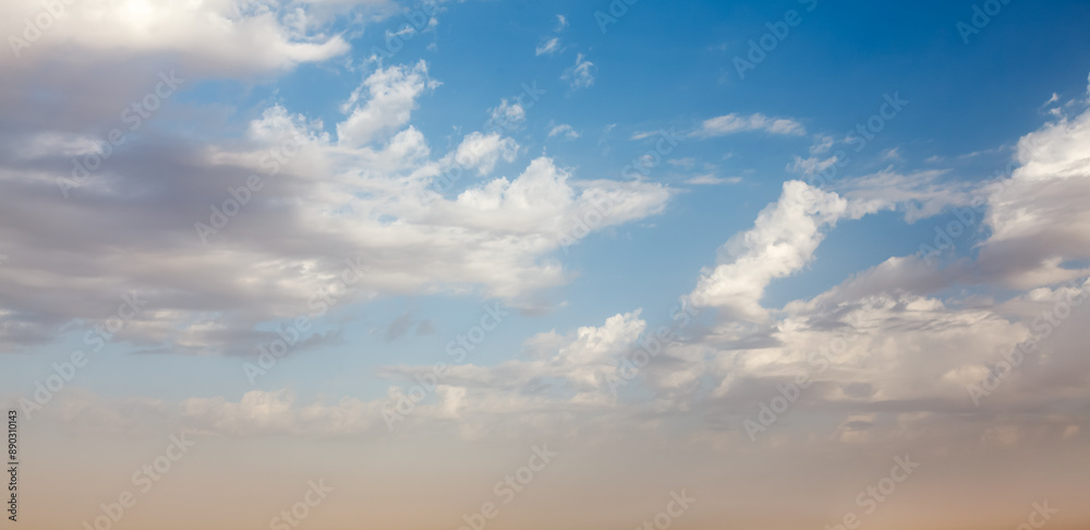 Fototapeta premium Peaceful and serene sky with clouds on sunset background
