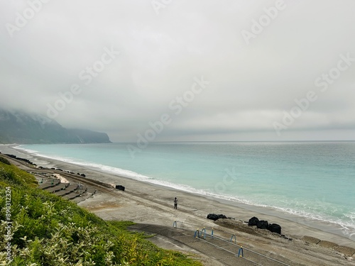 Habushiura Shore is a 6.5-kilometer-long white sand beach that rests under tall cliffs on the eastern side of Niijima Island in Tokyo JAPAN photo