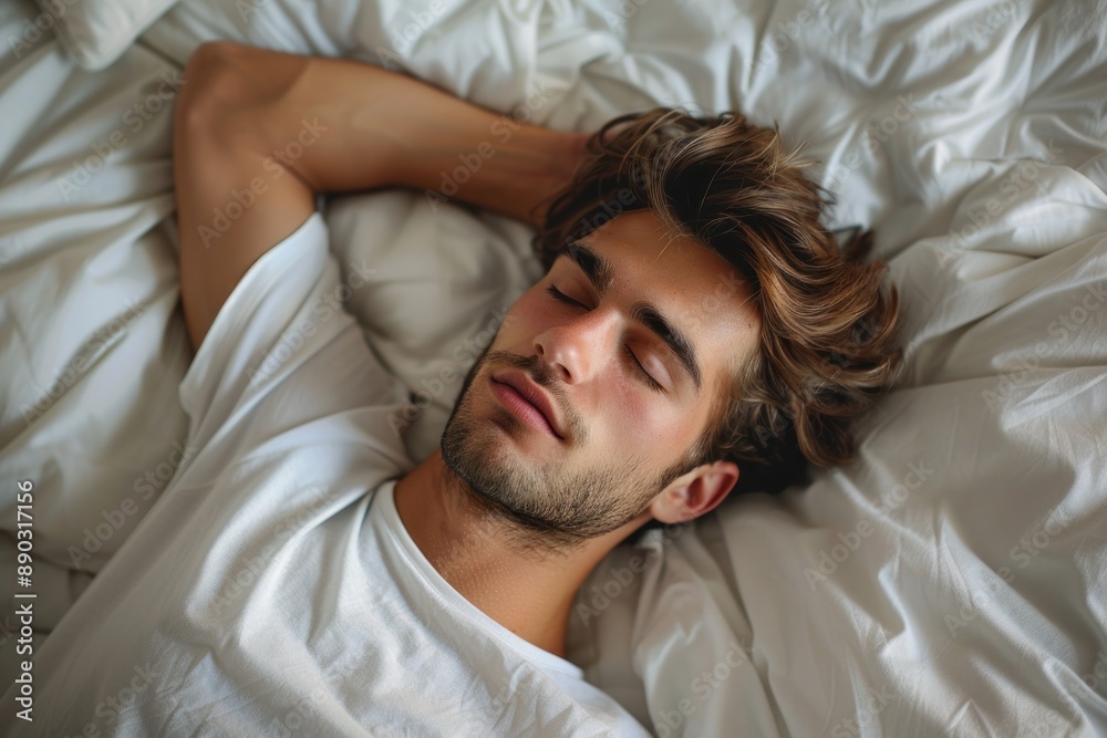 Top view of a young man sleeping lying in bed Top view of a young man sleeping lying in bed
