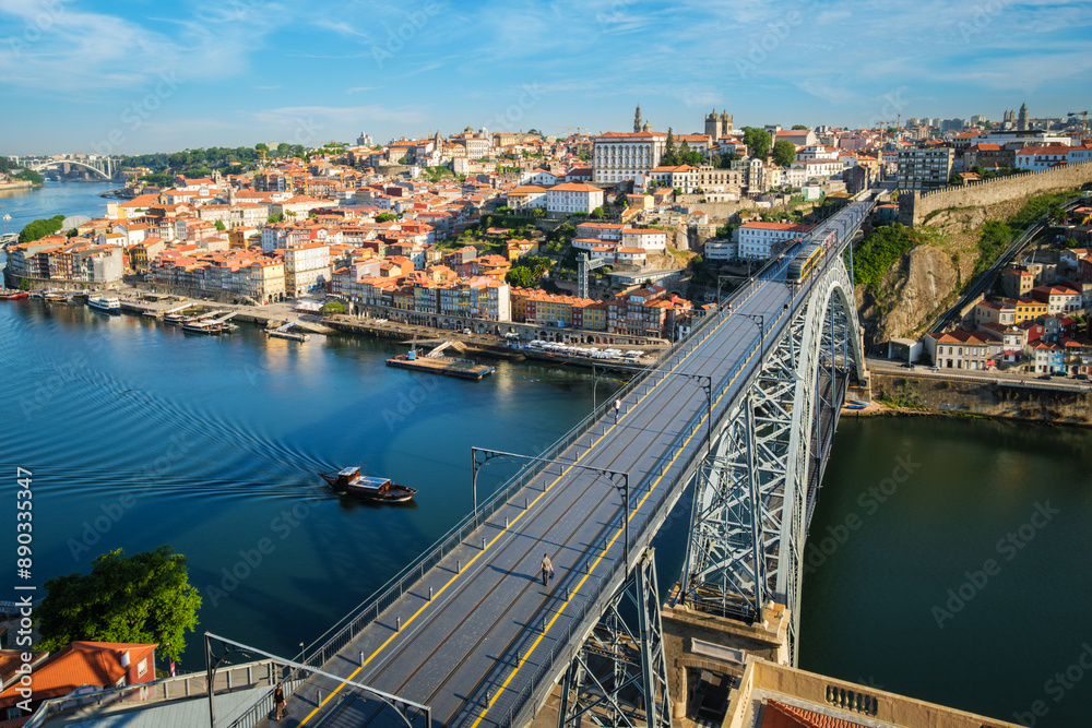 Obraz premium View of Porto city and Douro river and Dom Luis bridge I with metro tram from famous tourist viewpoint Miradouro da Serra do Pilar. Porto, Vila Nova de Gaia, Portugal