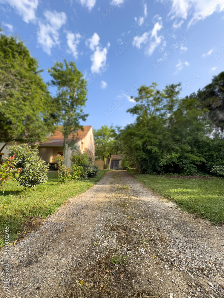 path or road in countryside leads to village path or road in countryside leads to village