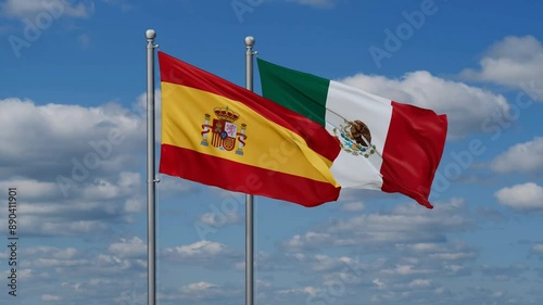 Mexico and Spain flags flying together, video concept of the relationship, two country relations concept