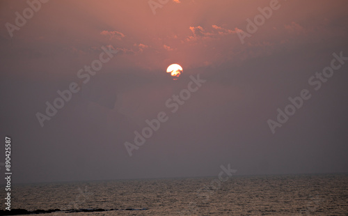 The setting sun at Murud beach. Murud is located 60 kms south of Alibag on the west coast of India. photo