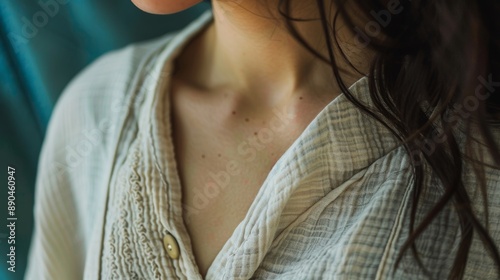 Close Up of a Woman's Delicate Skin and Open Collar photo