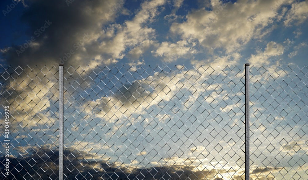 Mesh wire fence and sunset sky - 3d illustration Mesh wire fence and sunset sky - 3d illustration