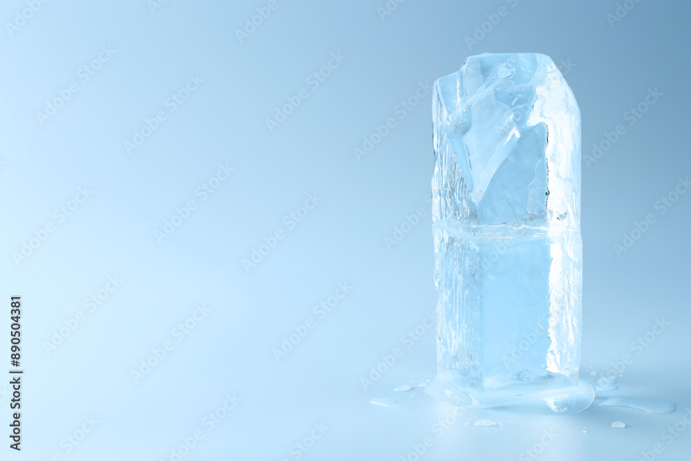 Blocks of clear ice on light blue background, space for text Blocks of clear ice on light blue background, space for text