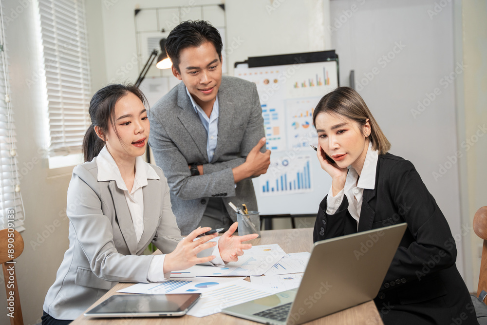 Asian businessmen, women and men Talk about new projects, presents at home office. Asian businessmen, women and men Talk about new projects, presents at home office.