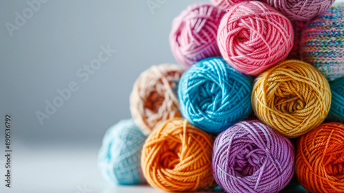 Stack of colorful yarn balls arranged in a pyramid shape