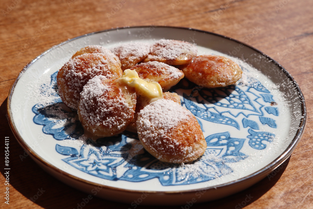A plate of poffertjes A plate of poffertjes